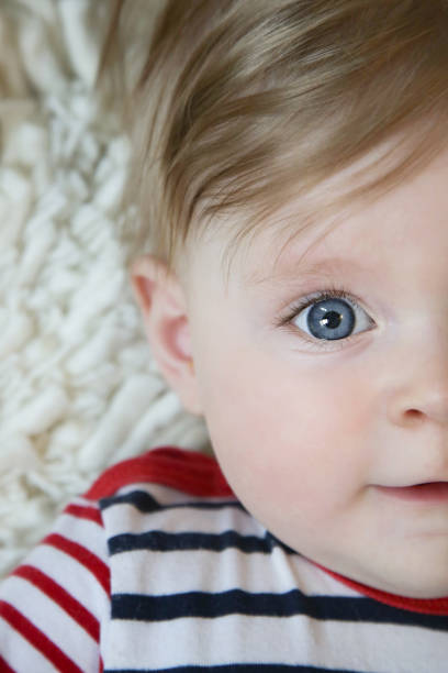istock Adorable baby with blue eyes, natural light portrait 962921328