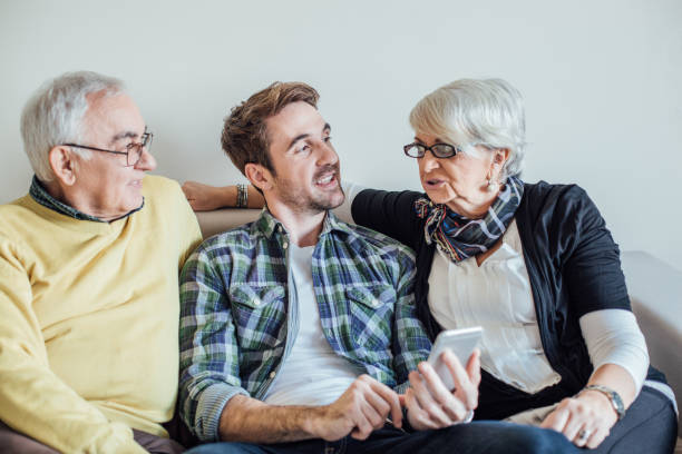 istock Parents looking at adult son 962924266