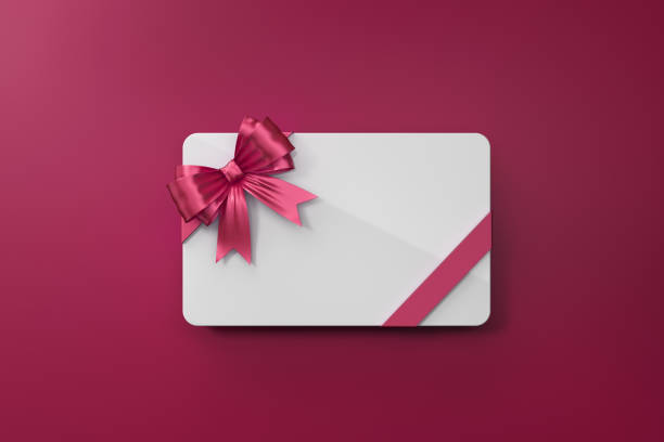 istock White Gift Card With Pink Bow Tie On Pink Background 962925366