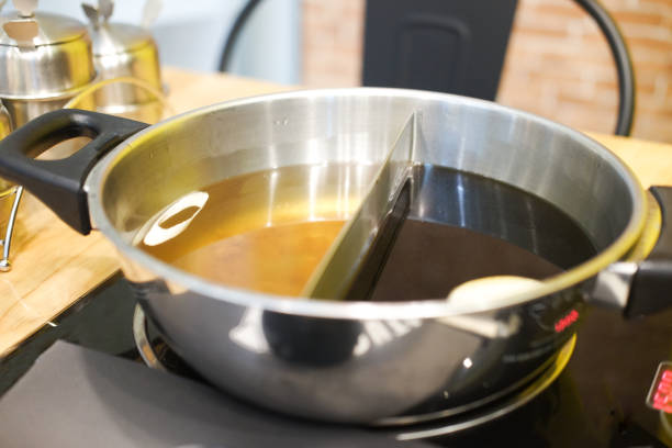 istock Shabu soup 2in1 in pot on table. Selective focus 962925404