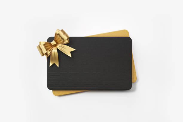 Black and gold colored gift card with gold colored bow tie on white background. Horizontal composition with clipping path and copy space.