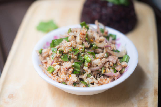 istock Thai spicy minced pork salad on with bowl 962925828