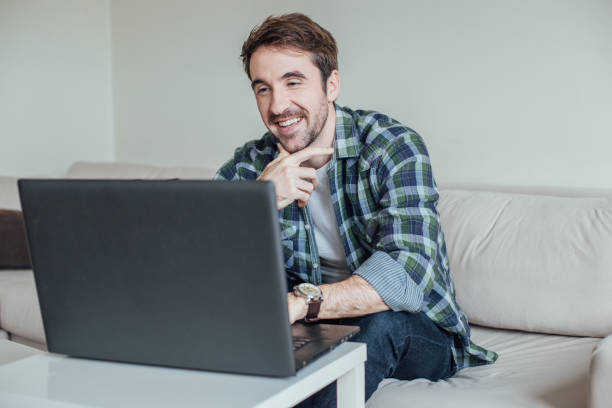 istock Happy businessman typing on laptop 962926112