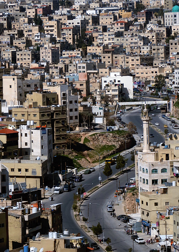 a main thoroughfare winding through the populous hills of downtown amman, jordan