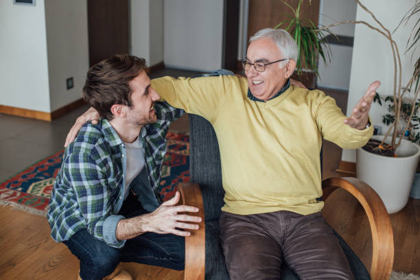 istock Father and son hugging and talking at home 962929174