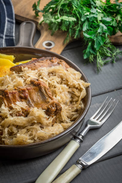 istock Fried ribs in sauerkraut. 962930144