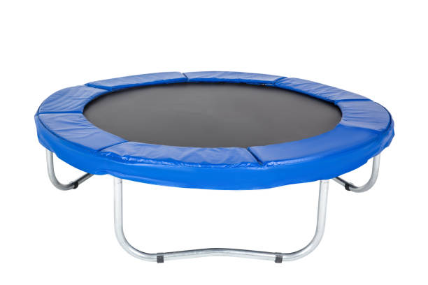 Trampoline for children and adults for fun indoor or outdoor fitness jumping on white background. Blue trampoline Isolated stock photo