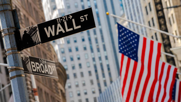 Flag and Wall street sign Flag hanging on a facade wall street lower manhattan photos stock pictures, royalty-free photos & images