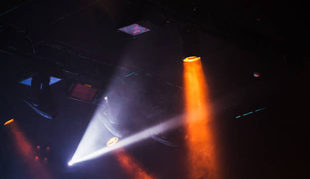 istock Spot lights beams in scenic smoke 962939684