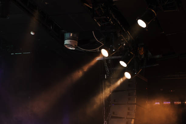 istock Spot lights with strong beams in smoke 962939690