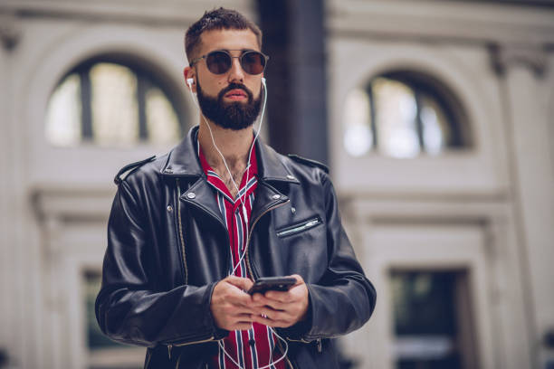 istock Modern guy listening music 962943186