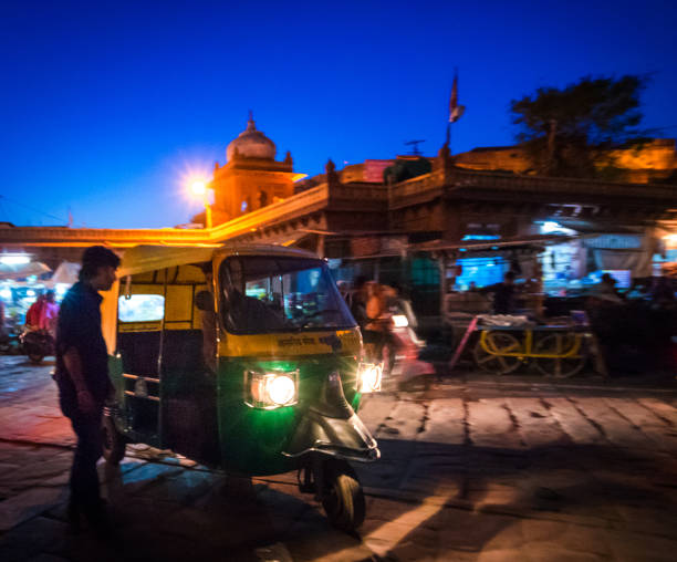 Man stops an auto Rickshaw Taxi India Man stops an auto Rickshaw Taxi India auto rickshaw taxi india stock pictures, royalty-free photos & images