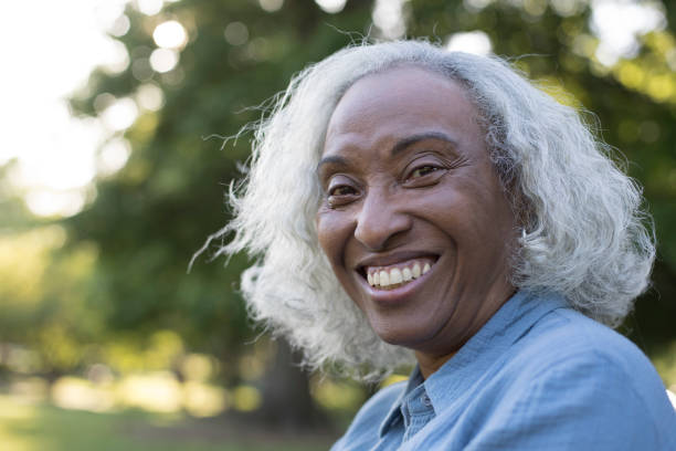 istock Senior Woman Outside Laughing 962952504