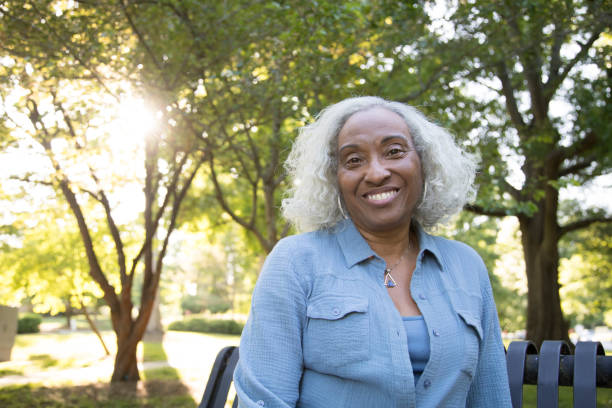 istock Senior Woman Outside on a Bench 962952644