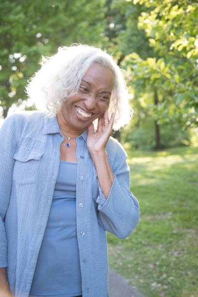 istock Senior Woman Outside Laughing 962952898