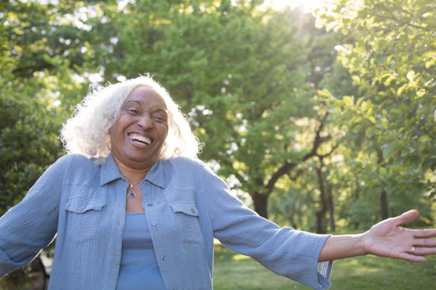 istock Senior Woman Outside Laughing 962952960
