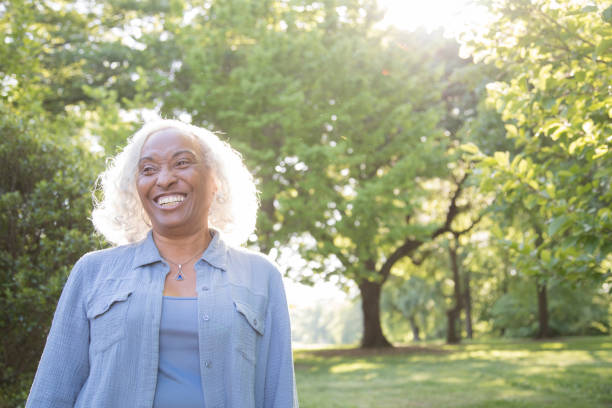 istock Senior Woman Outside Laughing 962953014