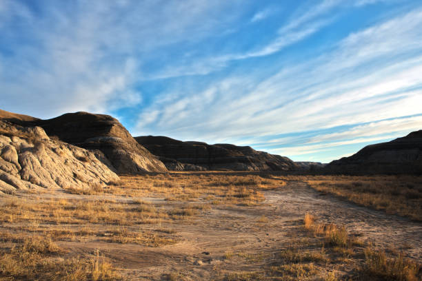 HDR Landscape of the Canadian Badlands at Sunrise in Alberta, Canada High dynamic range image of the beautiful landscape of the Canadian Badlands at sunrise in Alberta, Canada. drumheller stock pictures, royalty-free photos & images