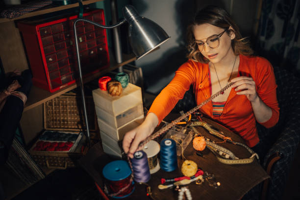 istock Beautiful woman working in the workshop and making jewelry 962954000