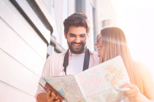 istock Happy couple with map choosing first destination 962957804