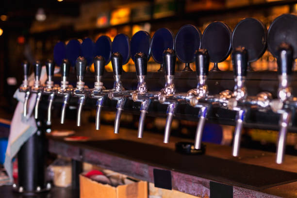 istock Beer tap row in bar counter 962958030