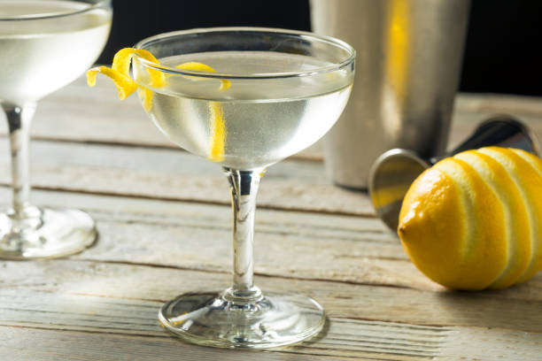 Homemade Alcoholic Vesper Martini Homemade Alcoholic Vesper Martini with a Lemon Twist martini stock pictures, royalty-free photos & images