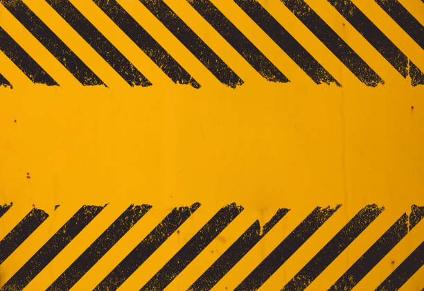 istock Yellow background with black grunge hazard sign 962958586
