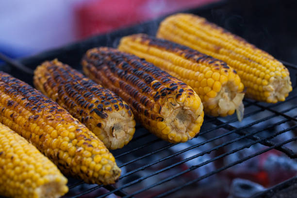 istock Fresh roasted or grilled corncobs. Grilled Corn for sale on the street. 962958978