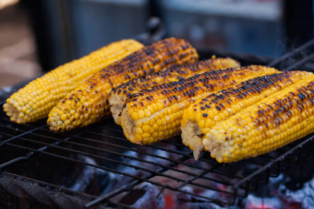 istock Fresh roasted or grilled corncobs. Grilled Corn for sale on the street. 962958996