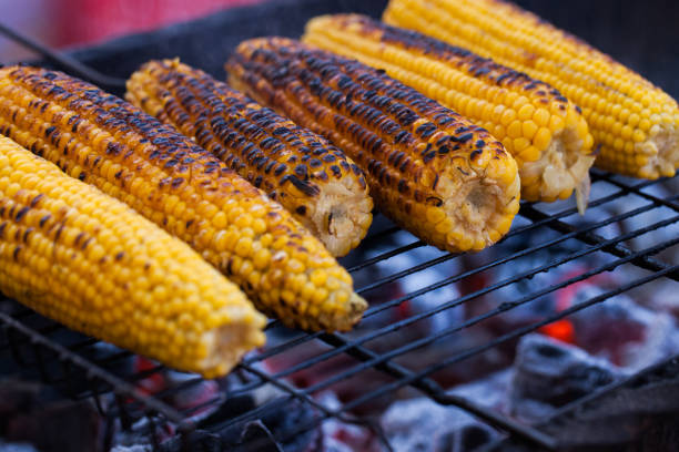 istock Fresh roasted or grilled corncobs. Grilled Corn for sale on the street. 962959000