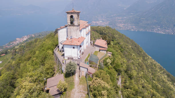 Drone aerial view of the Sanctuary of the Madonna della Ceriola on the top of the Monte Isola island stock photo