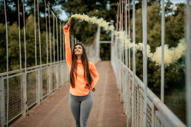 istock Woman with smoke bomb 962966224