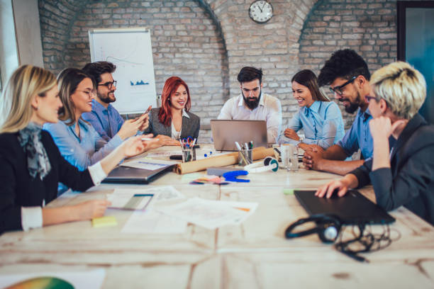 istock Business people working in office together. Team work in office. 962969514