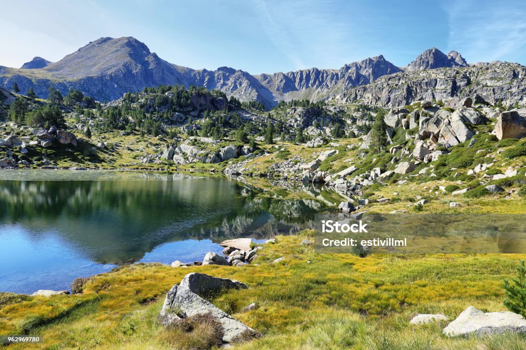 Reflection at the first lake in the circuit of Lake Pessons, Andorra Reflection im lake in the circuit of Pessons Lakes mountain passs, Andorra Andorra Stock Photo