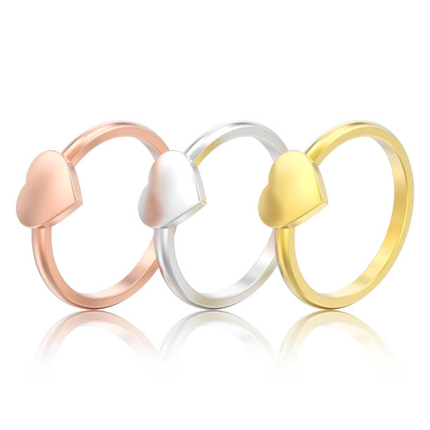 istock 3D illustration three isolated different gold engagement wedding heart rings 962970686