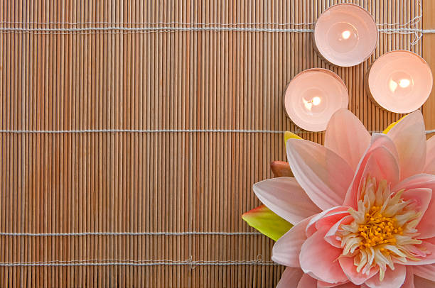 Lotus Flower and Candles on Bamboo, SPA Background, with Copyspace stock photo