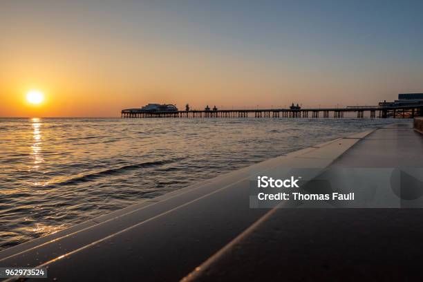 Sunset Over The Promenade In Blackpool Lancashire Stock Photo - Download Image Now - Beach, Blackpool, Coastline