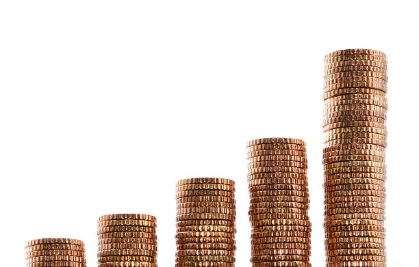 Growing Stacks of Golden Coins on White Background, Front/Low view stock photo