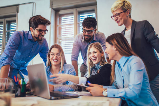 istock Business people working in office together. Team work in office. 962974658