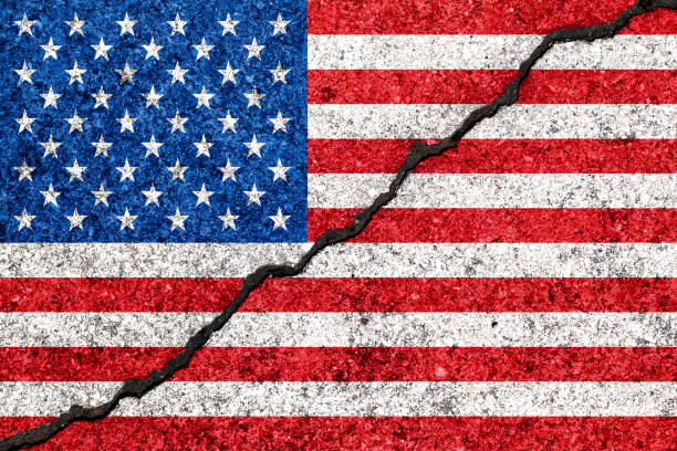 United States flag painted on cracked wall background/USA divided concept United States flag painted on cracked wall background/USA divided concept populism stock pictures, royalty-free photos & images