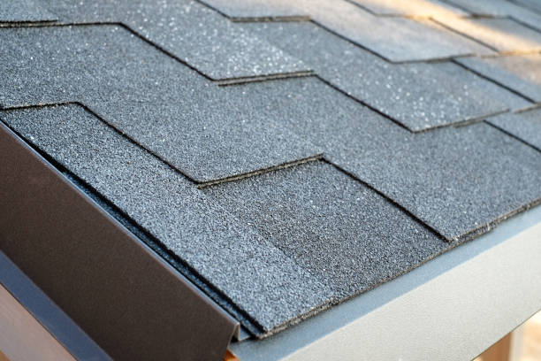 istock Close up view on corner roof made is asphalt roofing shingles 962984030