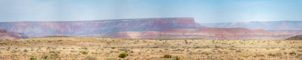 istock View of Dust Tornado On Open Field with Large Red Mountain in the background 962988714