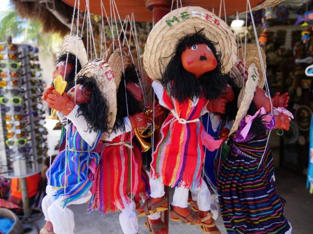 COSTA MAYA, MEXICO—JANUARY 2018: Dolls dressed in colorful Mexican costumes are one of the best-selling souvenir items for tourists in Costa Maya.