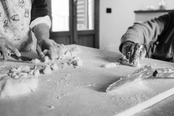 istock Latin adopted male boy preparing pasta 963004142