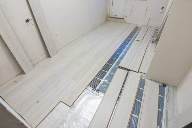 Laying laminate with warm floor film