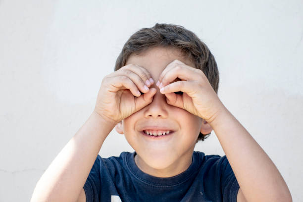 istock Smiling boy did fingers like binoculars 963008810