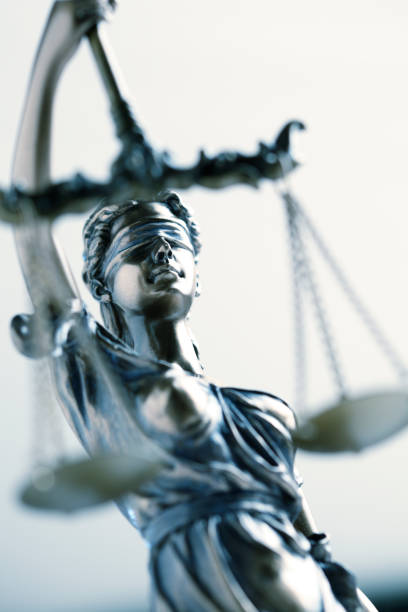 istock Statue Of Lady Justice In Front Light Colored Background 963011840