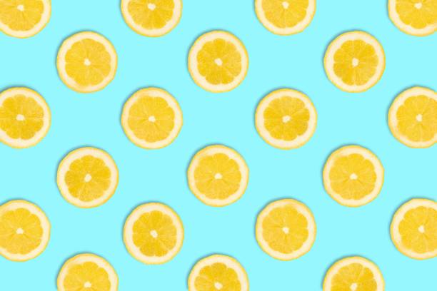 istock Fruit pattern of lemon slices on a pastel blue background 963014944