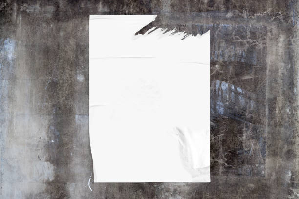 Weathered concrete wall with a blank poster