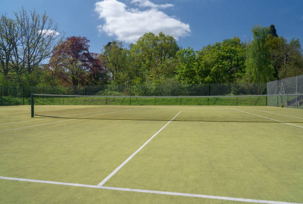 istock Open view of tennis court on artificial grass 963036680